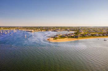 Nantucket harbor with an aerial view of boats and the downtown