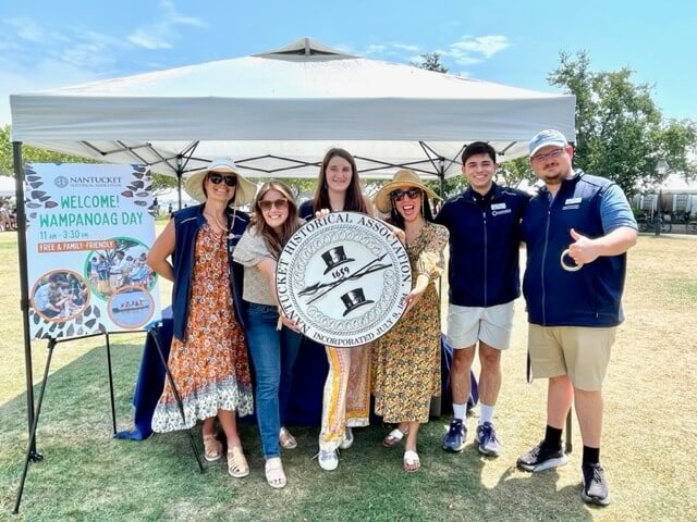 Group of six interns holding the NHA seal.