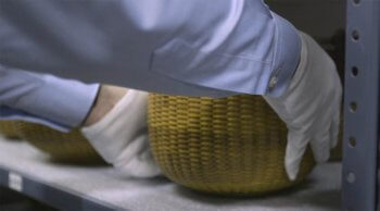 NHA Curator preserving lightship basket.